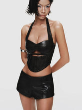 Person wearing a black leather outfit